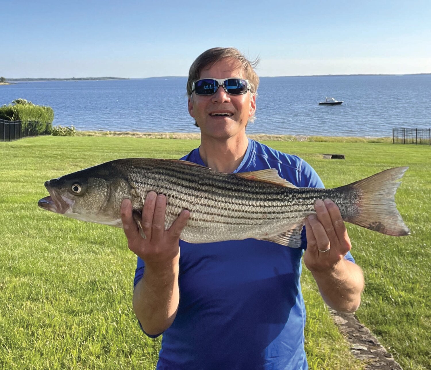 BIG CATCH: Brian Abbott of Barrington, said, “Caught this striper (29 inches, 8 pounds) in 15 feet of water about 100 yards off Barrington Beach with a Yo-Zuri Crystal Minnow.” (Submitted photo)